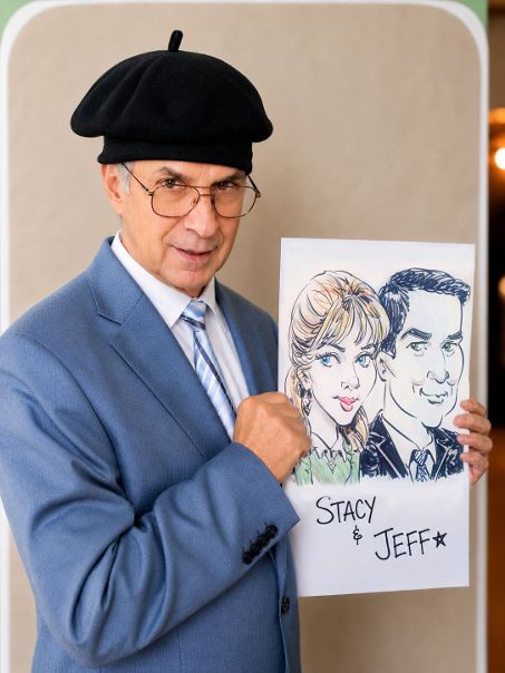 Caricature artist Martin Tremblay holding a couple's caricature of Stacy & Jeff